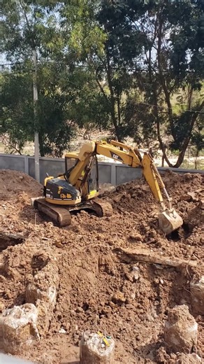Digging and crushing soil to make a building foundation. #excavator #shorts