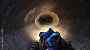 Border patrol agents use a remote controlled robot to explore a drug smuggling tunnel on the U.S. Mexico border.