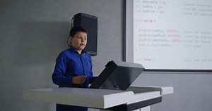 clip-3549855217-genius-schoolboy-speaking-classroom-presenting-program-code