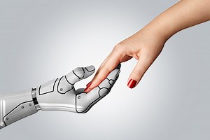Robotic cyborg hand holding female human hand on gray background....