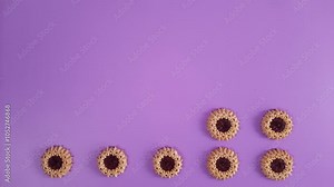 Stop motion animation with cookies. Round shortbread cookies appear and disappear in turn in two rows. Desserts template with bakery, nutrition, diet, restocking theme