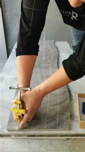 manual tile cutter to make a precise, curved cut on a large format porcelain or ceramic tile