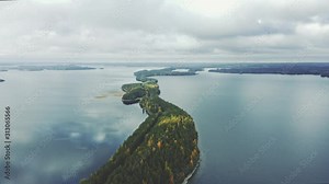 Aerial view lake and road island forest line landscape travel drone scenery from above in Finland scandinavian nature beautiful destinations