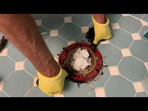 How install a cast Iron toilet flange in a concrete floor to a cast iron sewer drain pipe