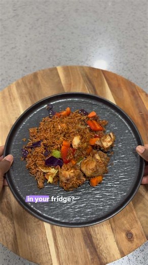 I turned my leftover jollof into a colorful stir fry with juicy pan fried chicken and crunchy veggies. Would you try this with your Jollof ? #ghanajollof #jollofrice #ghanaianfood #foodcontentcreator