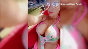 Coco Austin shows her assets in voluptuous pink swimsuit