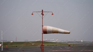 Airport Windsock - Wind Direction Indicator At The Haneda Airport. - static shot