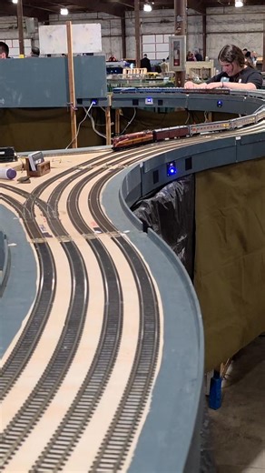 The PRR GG1 winds its way past the camera, and eventually slides right by it's much younger descendant, which is idling on a nearby track | Reading and Lehigh Railroad, N scale