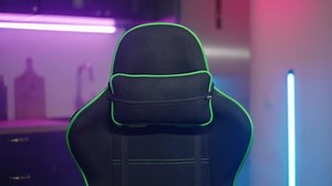 Empty gaming chair moving with colorful kitchen in background 4K