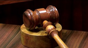 Suspended Arkansas professor indicted on fraud counts