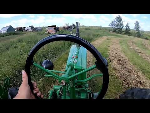 1941 John Deere H Tedding Hay.