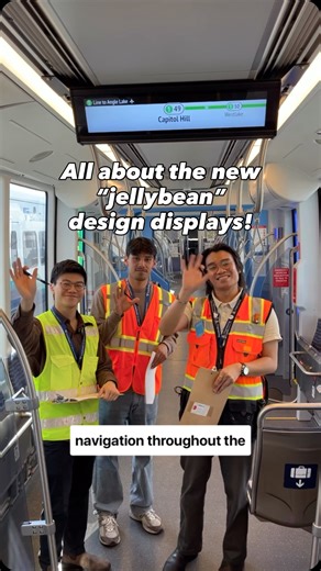 Sound Transit on Instagram: "Have you seen the new design displays on board Link trains? They’re part of our switch to station codes, which will make our transit network easier to understand and use. Click the 🔗 in our bio to learn more. What do you think of the “jellybeans”? 🎥: @henryonboard Video description: Sound Transit employee Cameron stands near a Link light rail vehicle in the yard, then boards the train with colleagues, while explaining the switch to jellybean design displays."