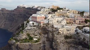 Famous Greek island of Santorini and the town of Thira, aerial view of popular resort in Greece, flying above colourful houses of Thira, amazing romantic town in Greece. Stock Video