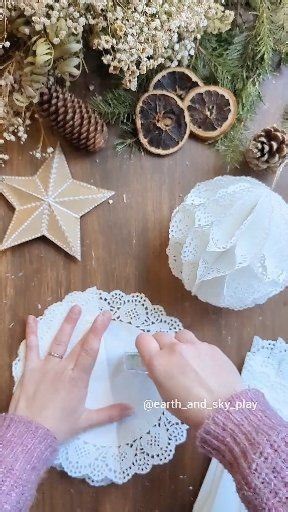 Christmas time means the doilies are out! These Paper Doily Baubles lovely and quick to make! I ran out of my small doilies so had to go big and I actually love it 🤣 If you want to try making this festive craft: • You'll need 16 paper doilies • Fold each in half • use glue or double sided glue tape (used in my reel) to glue down the middle of one side • open your doilie then glue one third down and two thirds down as shown • you then layer each doily following these two steps • add your hanging
