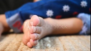 closeup of little girl feet on a mat Stock Video