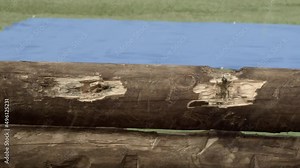 Bullet hits special effect over a wood fence and a bluescreen in the background Stock Video