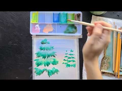 Watercolor tutorial painting of snow-covered evergreens. Perfect for beginners.