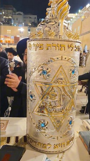 Jews celebrate the Simchat Torah holiday at the Western Wall in Jerusalem, Israel, 2025