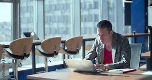 Businessman working over computer screen in modern office 4k video. Business man at workplaces. Company staff in open space