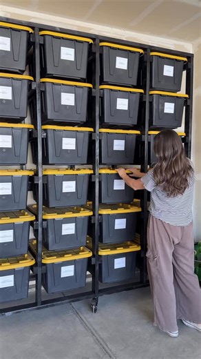 Haylee Griffin | DIY + Home on Instagram: "The Christmas take down🎄❤️ We built this shelving unit last year for all of our totes and it's been so great! Comment TOTE for links to the tutorial and supplies that we used! #diytotestorage #garageorganization #christmasstorage #diytutorial #diyhomeprojects"