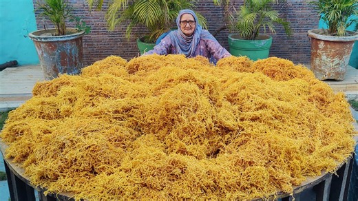 Indian granny making mega portion of snack for the kids