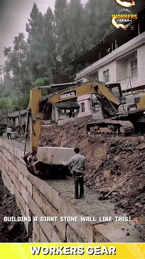 Excavator-Assisted Stone Block Placement for Building Large Retaining Walls in Construction Sites
