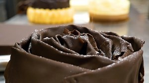 23K views · 832 reactions | At Porto’s the details matter, join Jimmy Torres as he explains how we top our Tiramisu & Triple Chocolate Mousse Cakes with chocolate shavings | Porto's Bakery | Facebook