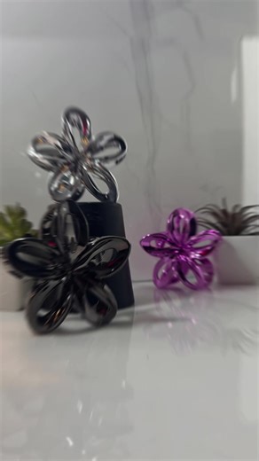 Soft girl vibes, but make it cute 🌸✨ Flower claw clips in metallic : black , silver or purple — perfect for effortless updos, cozy fits, and everyday slay. Strong hold, glossy finish, zero tugging 💅🏽 Which one are you choosing? 🖤🩶💜 #ClawClips #HairAccessories #SoftGirlAesthetic #CuteHair #EverydayStyle