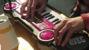 Circuit bent Kawasaki keyboard, amplifier, and audio transducers attached to lycra and paper cup