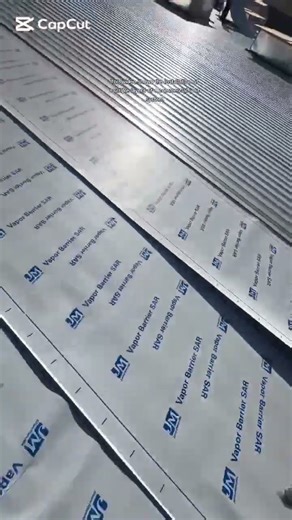 installation of multiple layers of a commercial roof system.#shortsfeed