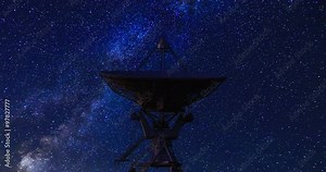 Satellite and Stars Rotating. a time lapse shot of a satellite with star and milky way rotating in the background