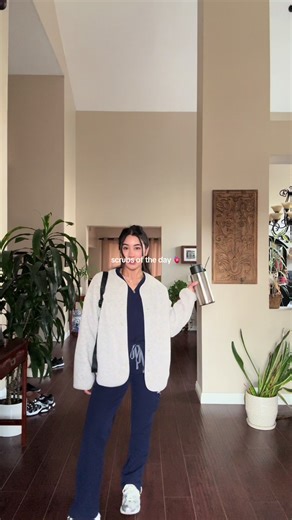 it ain’t a fashion show until it is, sis 😏😂 outfit details below! 👇✨ been loving on this fleece jacket. it’s the most versatile piece! 😆 scrubs! @wearfigs jacket! @UNIQLO USA sneaks! @New Balance #ernurse #ernurselife #scrubsoftheday #scrubs #newgradnurse