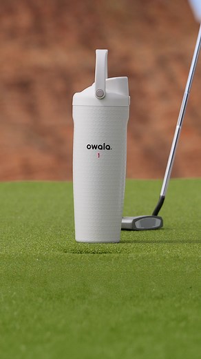 Looks like a golf ball. Feels like a golf ball. Hits just right. With an insulated bottle, iconic dimpled texture and big ole bucket handle, this bottle was made for the green. | Owala