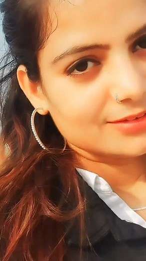 Hoop Earrings and Long Hair: A Close-Up Style Feature