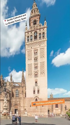Epic hyperlapse of the Seville Cathedral and La Giralda Tower standing proud under a brilliant sky