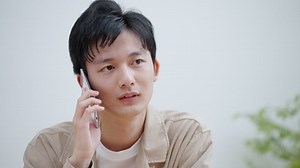 Young man making a phone call