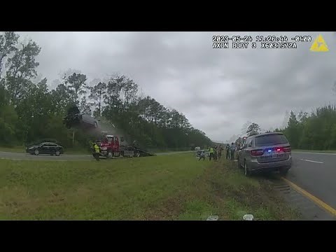 Raw video: Body cam footage shows car go airborne after hitting tow truck ramp