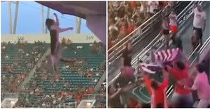 Fans Save Falling Cat By Catching It With A Flag At A College Football Game