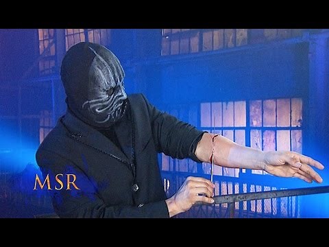 YIKES! MAGICIAN PLUNGES NEEDLE THROUGH ARM!