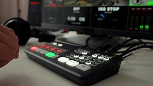 clip-3768970009-men-hand-switches-buttons-on-recording-console