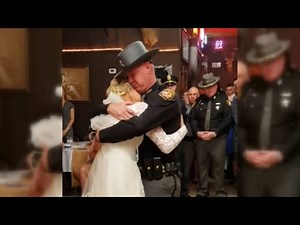 'Fathers in blue' surprise bride for father-daughter wedding dance