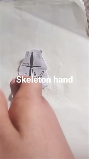 drawing of skeleton hand with a sword