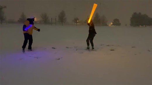 Lightsabers Clash on Snowy Night