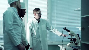 Video Stock Professor Is Showing A Microscope To Students Live Wallpaper Free