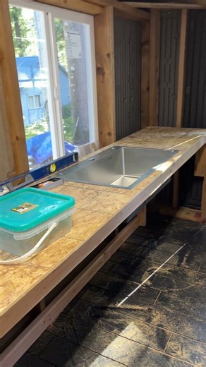 Costco 12’ x 8’ shed customized with framing, windows, door and counter sink.