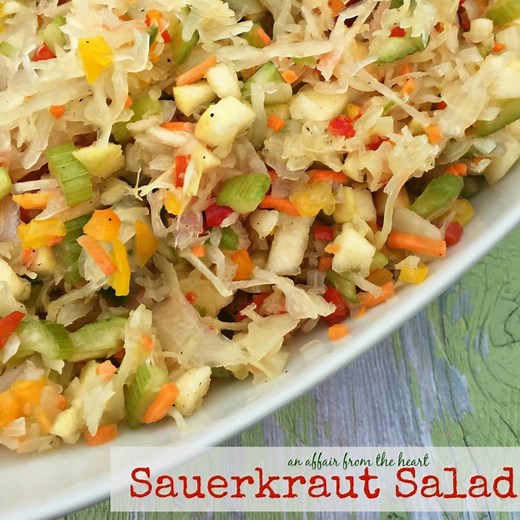 SAUERKRAUT SALAD - Tangy sauerkraut salad with crisp raw veggies and apples, marinated in a sweet dressing. Perfect as a side dish or to top off burgers, hot dogs or brats. The health benefits of sauerkraut are AMAZING. Read more and grab this delicious recipe today! An Affair from the Heart Printable Recipe: https://anaffairfromtheheart.com/2016/04/sauerkraut-salad/ Pin for Later: https://www.pinterest.com/pin/150378075036895503/ | An Affair from the Heart