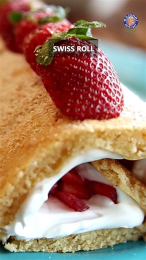 🍰🌀 Roll Into Delight: Easy Homemade Swiss Roll! 🌀🍫 Watch the entire recipe on our Rajshri Food YT Channel. Host: Priyanka Doshi Ingredients ( Serves 6 ) Melted butter – ½ cup Condensed milk – 3/4th cup Vanilla essence – 1 tsp Curd – 1/4th cup Flour – ½ cup Baking soda – 1/4th tsp Baking Powder – ½ tsp Whipped cream – 2 cups (volume) Chopped strawberries – 1 cup Copyrights: REPL #SwissRoll #DessertRecipe #EasyDessert #CakeRoll #HomemadeCake #BakingGoals #BeatBatterBake #Thanksgiving #RajshriF