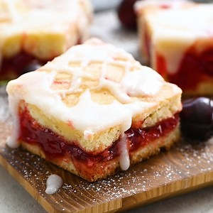 Recipe here: https://therecipecritic.com/cherry-pie-bars/ Cherry pie in the best form possible: cherry pie bars! You can whip up a whole pan of these bars in minutes using cherry pie filling. They’re pretty, easy to make, and always a hit to serve! | The Recipe Critic
