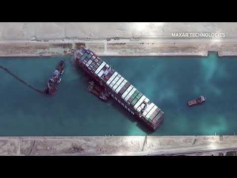 Dredge or tug? Suez authority tries to free stuck ship