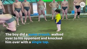 Sumo wrestling toddler takes on and defeats professional opponent in first match